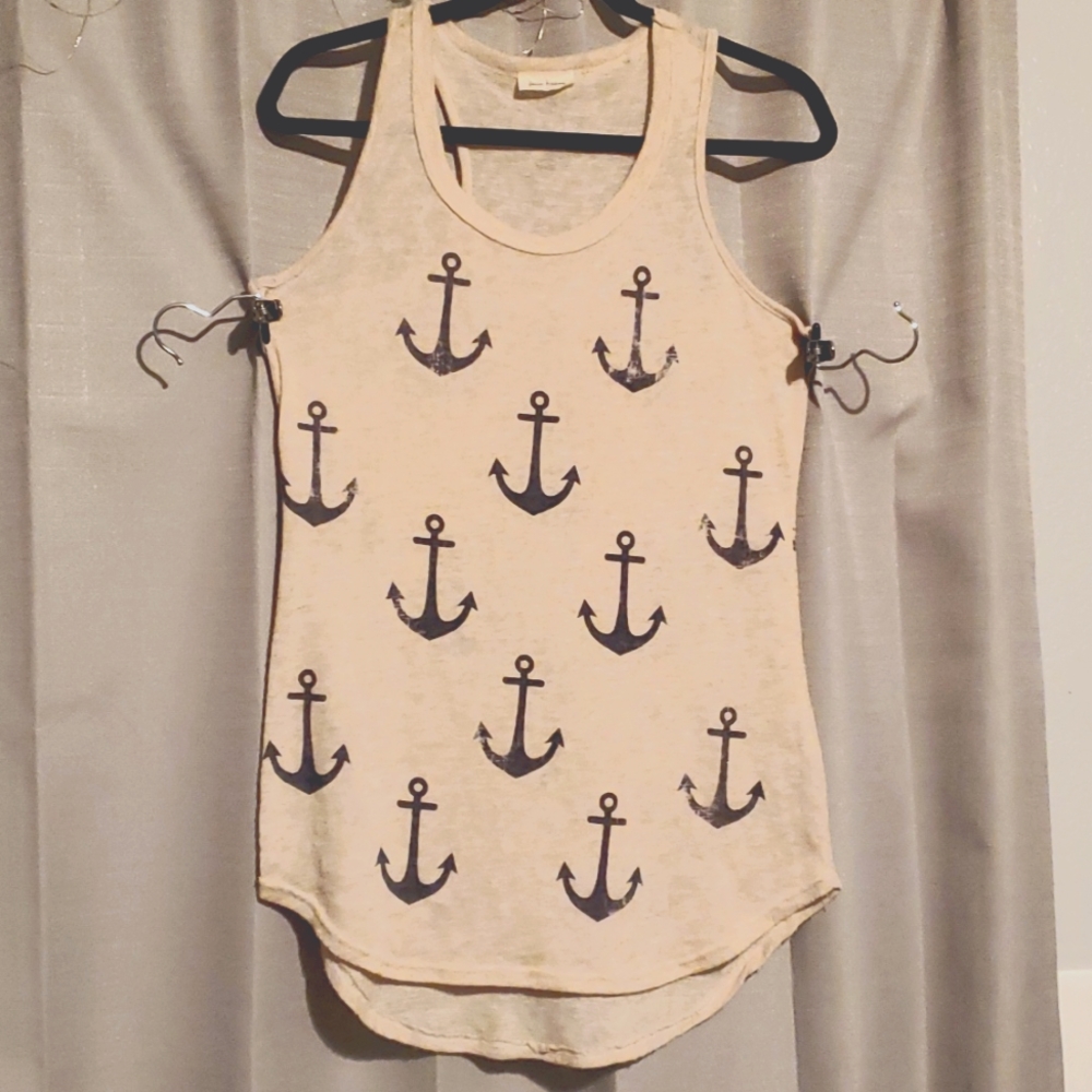 Cute beige tank with navy blue anchors. Size L